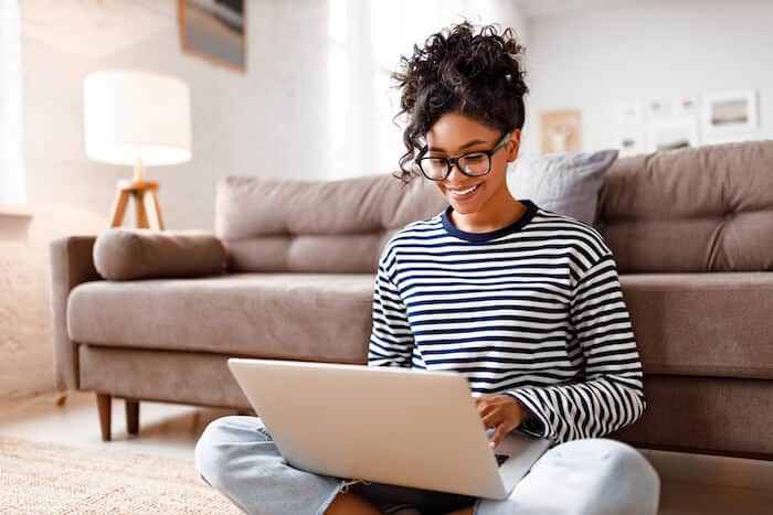 Amazon listing optimization: woman using a laptop