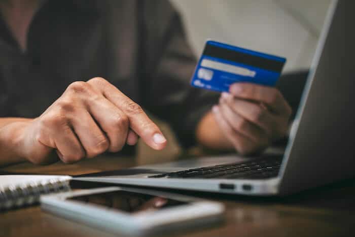 Ecommerce strategies: person inputting his credit card details online