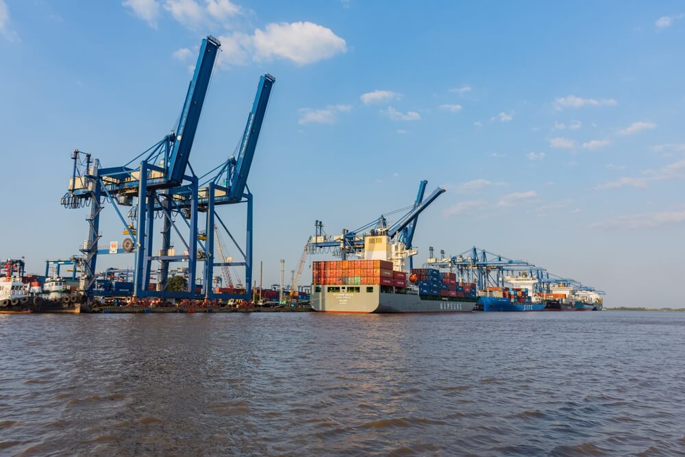 Ho ChiMinh City Vietnam port with boat and boxes ready to be shipped.