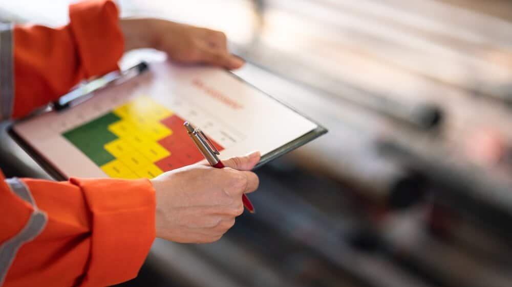 A factory owrker conducting a capability evaluation of the manufacturing plant.