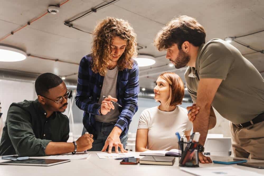 Team of people developing and designing a new product.