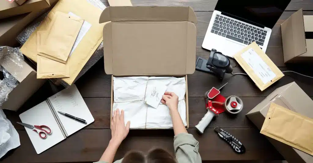 Dropshipping vs. Private Label comparison showing ecommerce order packing workflow and fulfillment setup on a worktable