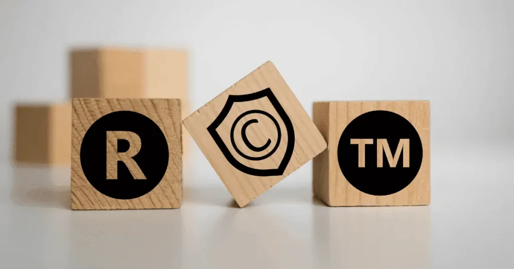 Toy-sized blocks with patent, copyright and trademark symbols on them.