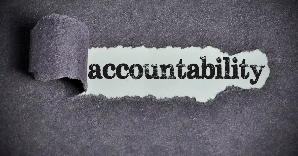 A close-up of torn paper reveals the word accountability, like a reminder that responsibility matters when working with partners or agents