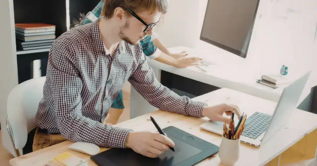 product design insights with designer using tablet and laptop to refine digital product concepts