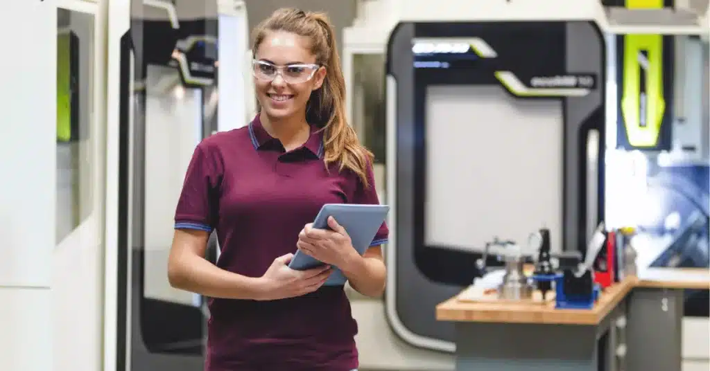 advanced product manufacturing facility with engineer using tablet for production quality control