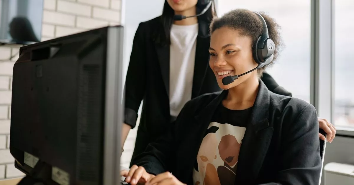 Another scene shows a support agent at a desk with a headset while a coworker stands nearby, suggesting teamwork and hands-on guidance