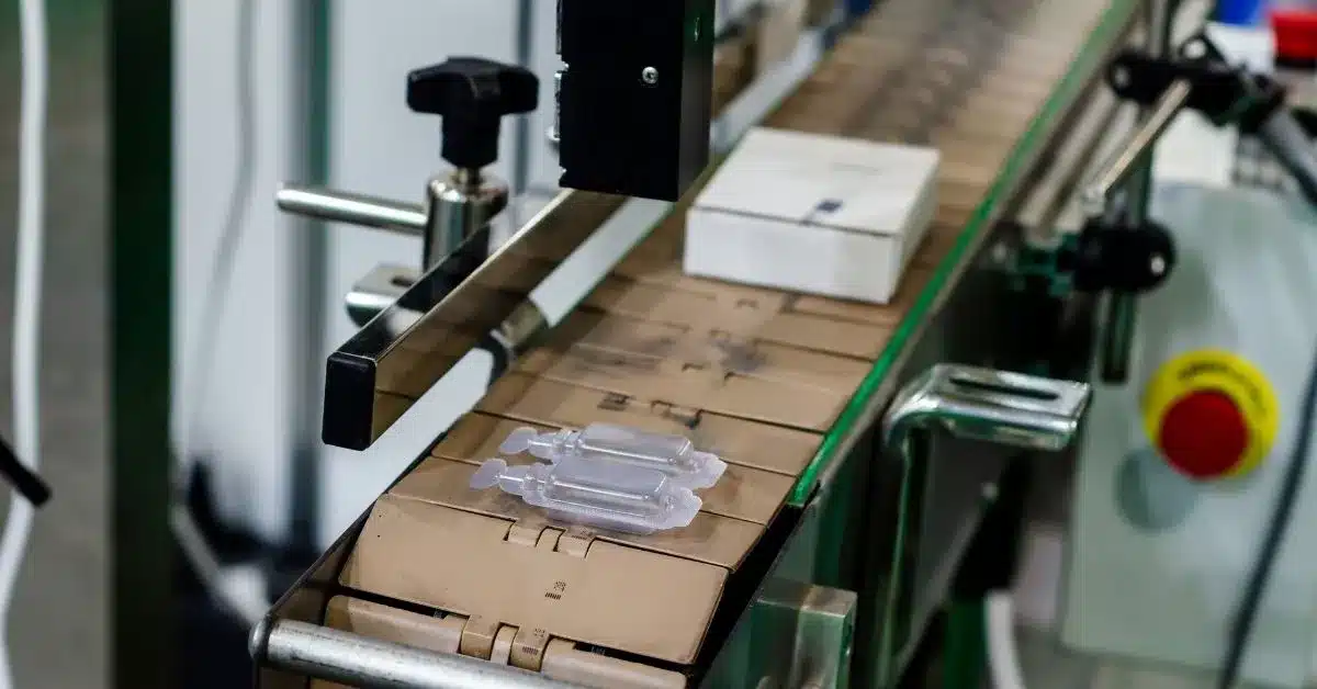 Products moving through an automated packaging line, representing the large-scale production capabilities available through private label and custom manufacturing partners.