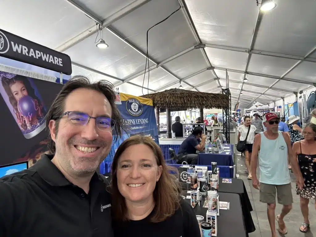 Wrapware founders David Murack and Michele Davolos at their custom tumbler printing booth at a live event