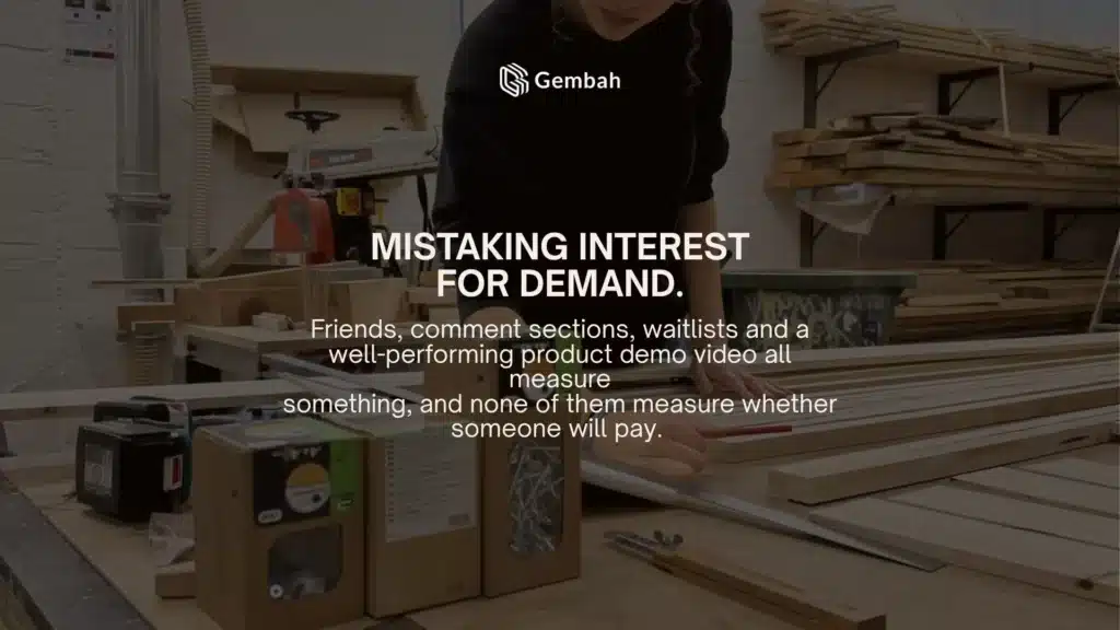 Maker measuring lumber in a workshop, illustrating the mistake of mistaking interest for demand